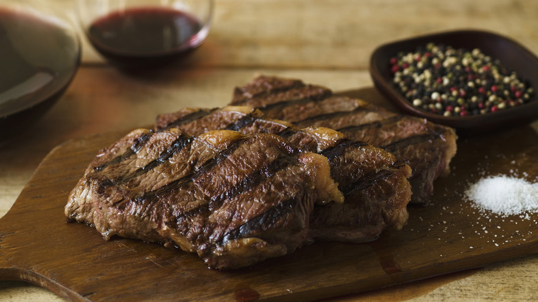 Steaks on a wooden board