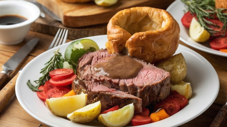 Roast beef with gravy, vegetables, and Yorkshire pudding