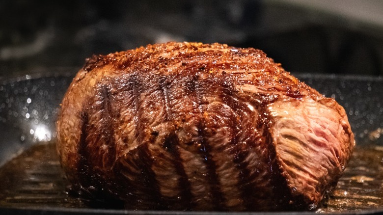 Roast beef cooks in an oven