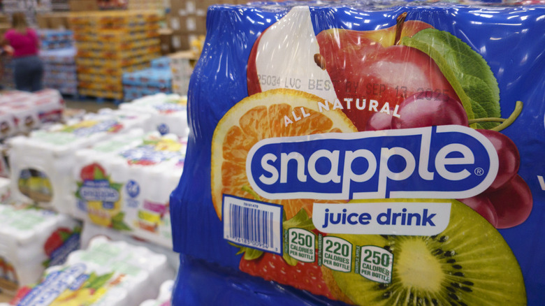 Cases of Snapple fruit drink stacked up in a wholesale market