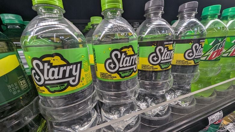 Four rows of Starry soda bottles at a store.