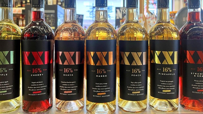 A variety of XXL wine bottles in a liquor store display