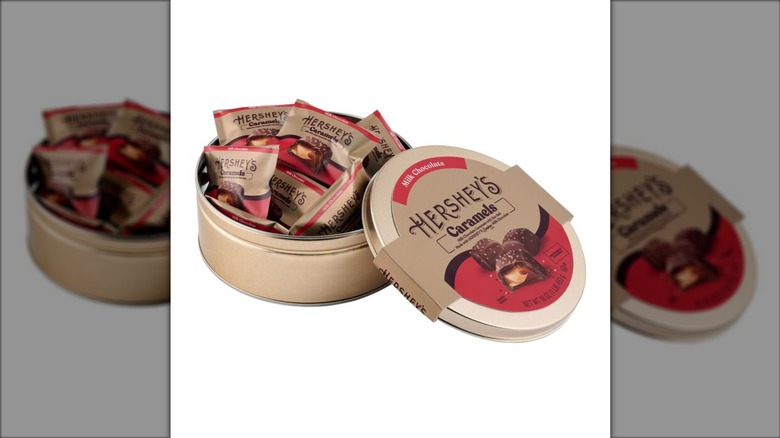 Hershey's chocolate covered caramels in a golden round tin