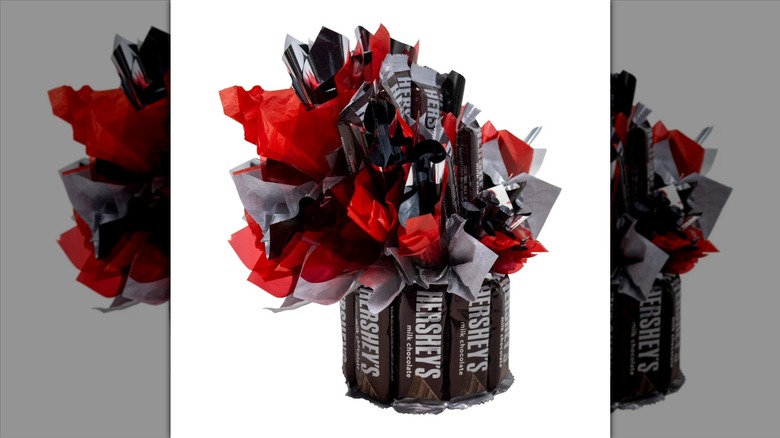 A bouquet made from Hershey's chocolate bars with red and black tissue paper accents
