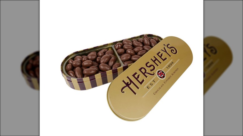 Hershey's chocolate covered almonds in a golden tin