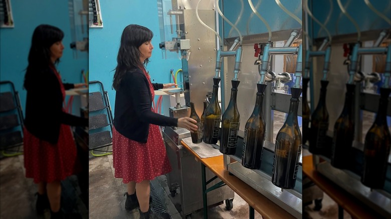 A woman bottling wine at Angeleno Wine Company
