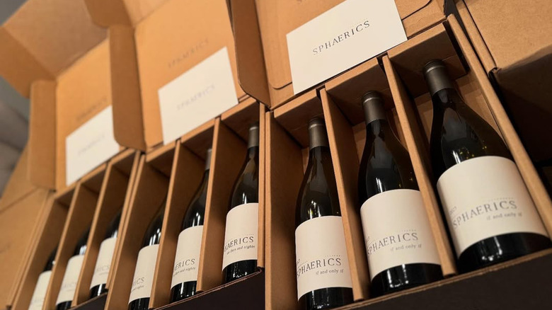 Opened boxes of Sphaerics wine bottles