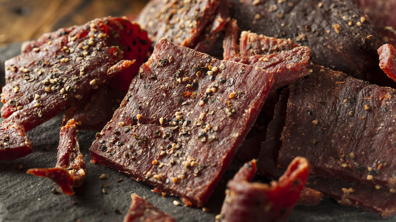 homemade beef jerky on a wooden board