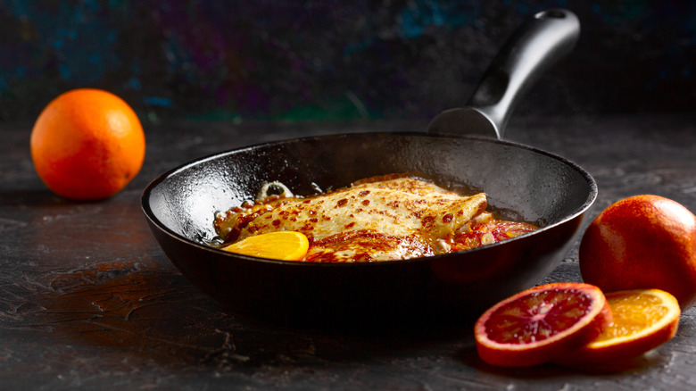 Crepes Suzettes in a pan with orange and Cointreau
