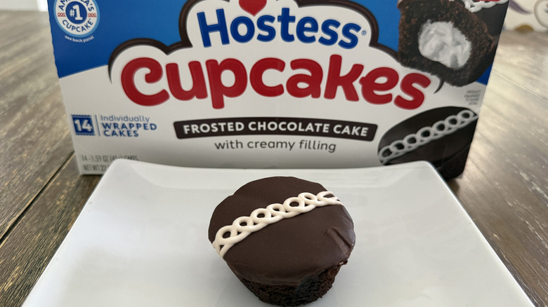 Hostess Chocolate cupcake on white plate with box in background