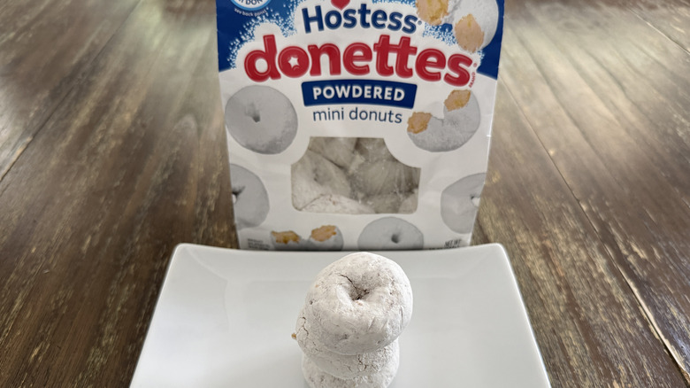 Hostess Powdered Donettes on white plate with box in background