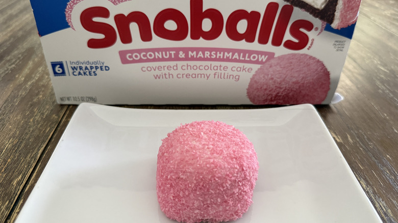Hostess Snoball on white plate with box in background