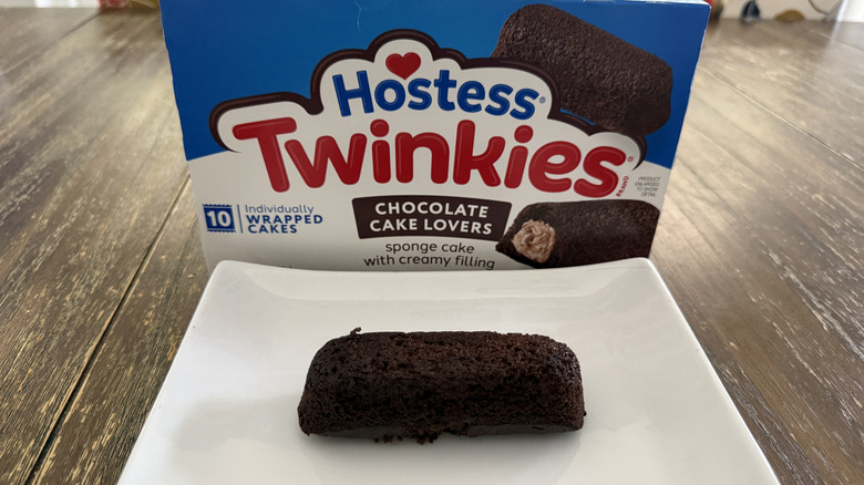 Hostess Chocolate Twinkie on white plate with box in background