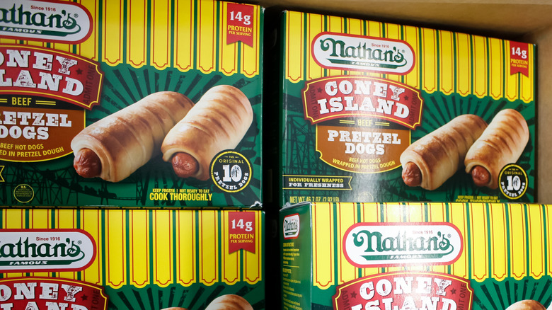 Boxes of Nathan's Famous pretzel dogs in supermarket freezer