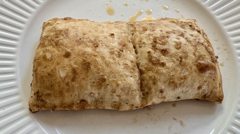 Hot Pockets Snack Breaks Cheesy Stuffed Pretzel with Bacon on a microwave plate