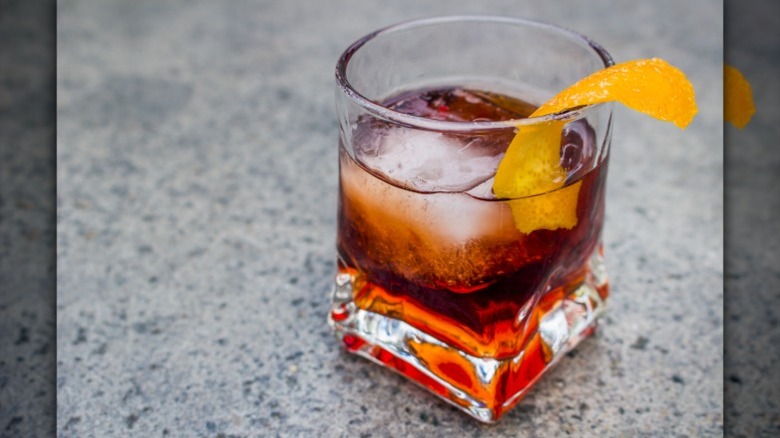 A negroni cocktail on a grey background