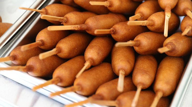 corn dogs in a metal bin