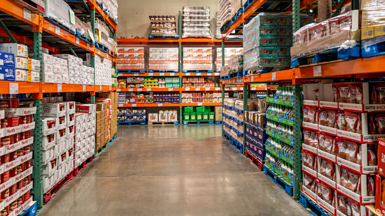An aisle stacked high with packaged foods inside Costco