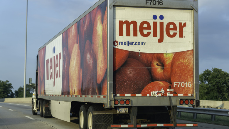 A Meijer grocery store delivery truck on the highway