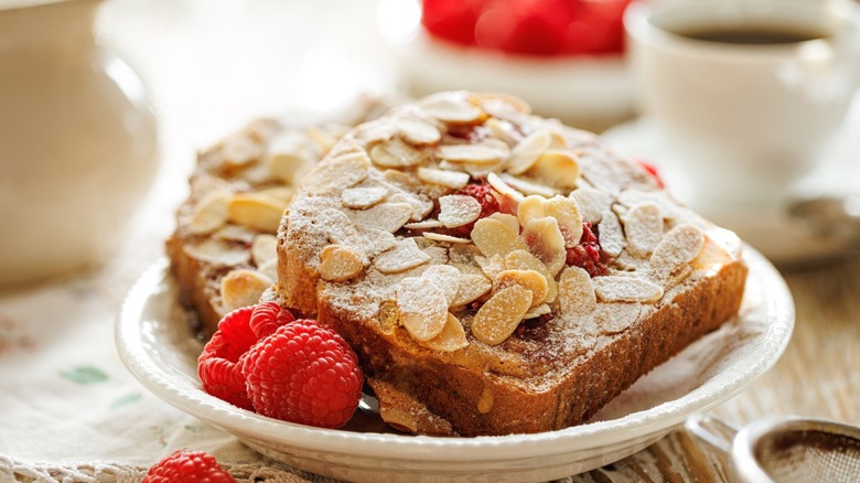 A plate of almond raspberry bostock.