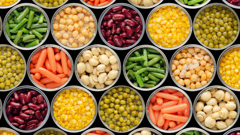 Top view of assorted open cans of vegetables