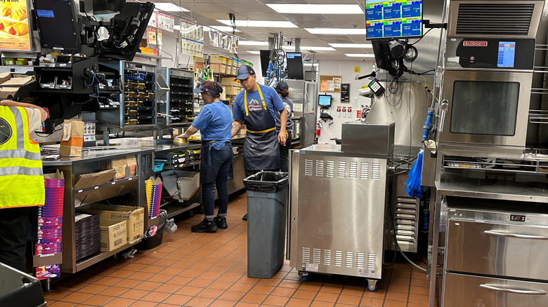 Workers working in a McDonald's kitchen