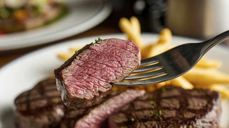 Piece of steak on a fork