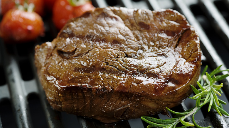 Well-done steak on a grill