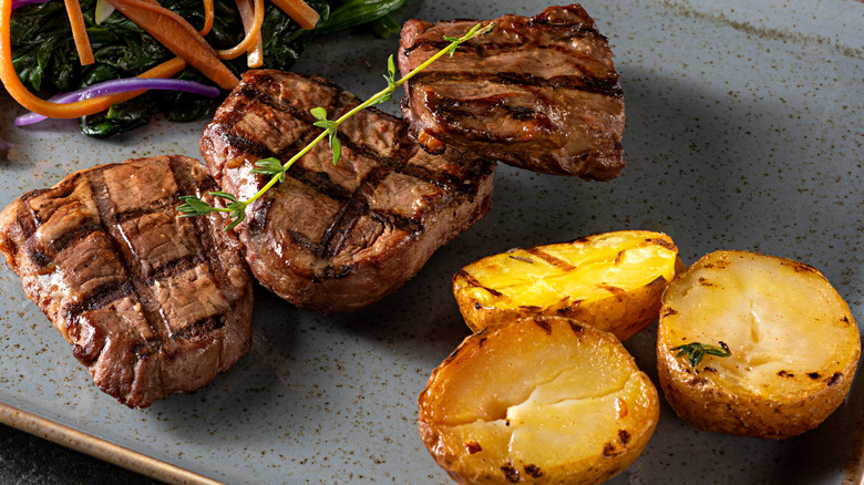 Steak and potatoes on a plate