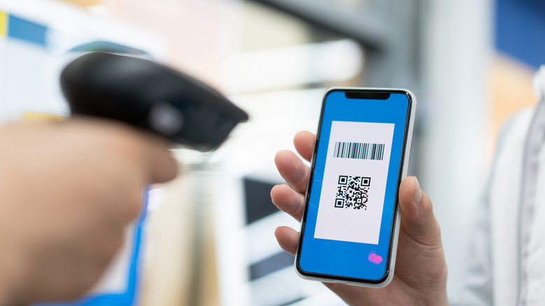 QR code on a phone being scanned