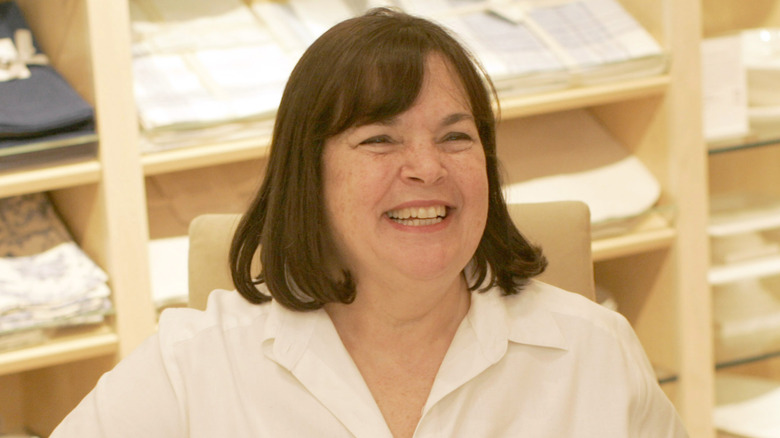 Ina Garten smiling inside a store