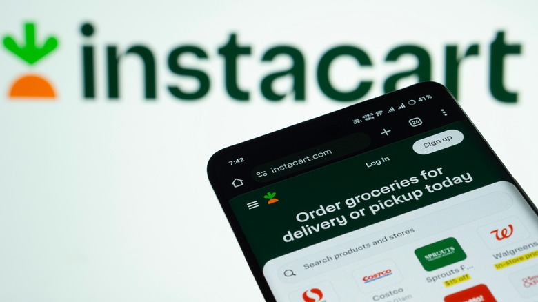 A smartphone displays the Instacart app against a background logo
