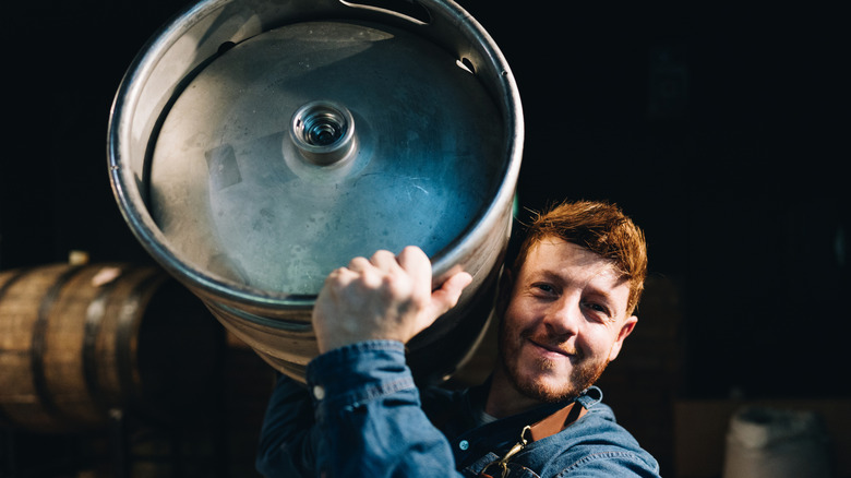 Person holding keg