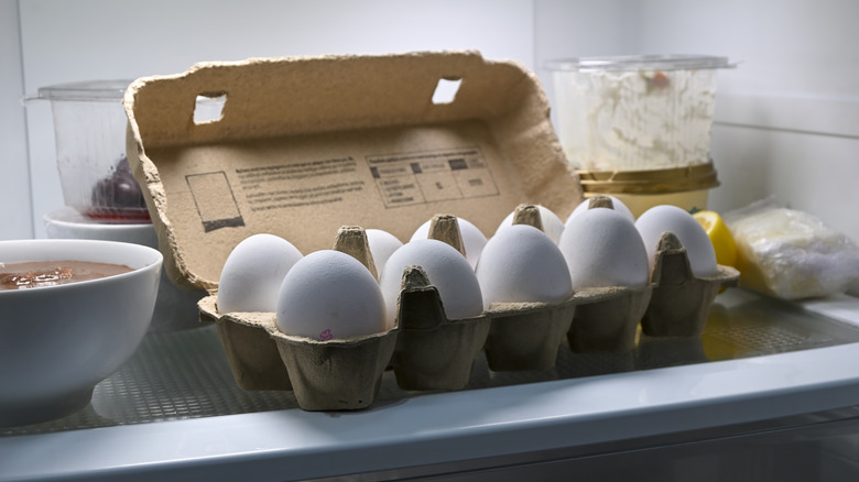 carton of eggs in refrigerator