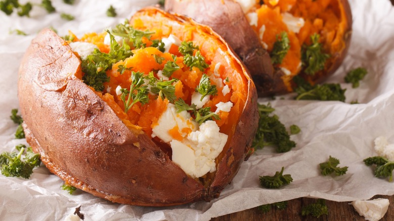 Baked sweet potato with feta cheese and parsley