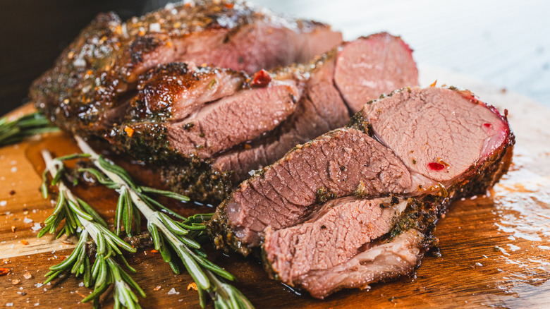 Cut lamb roast with herbs