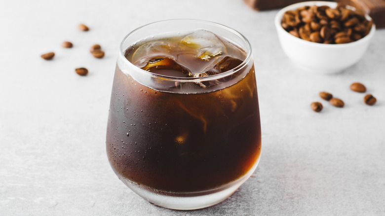 A cup of cold brew coffee on a counter