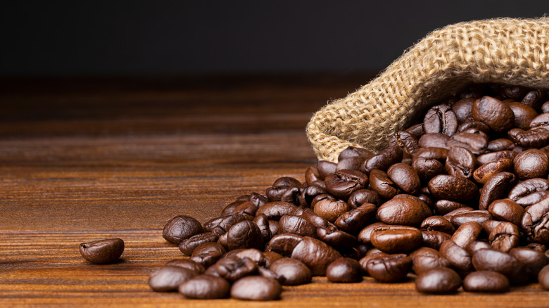 Coffee spilling out of a burlap bag