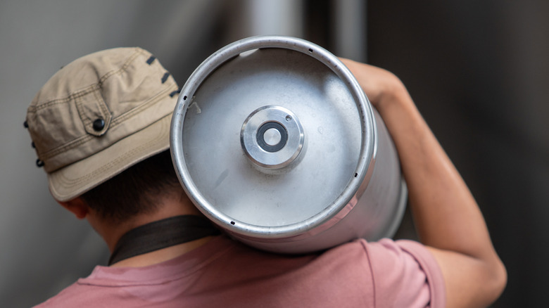 Man carrying beer keg