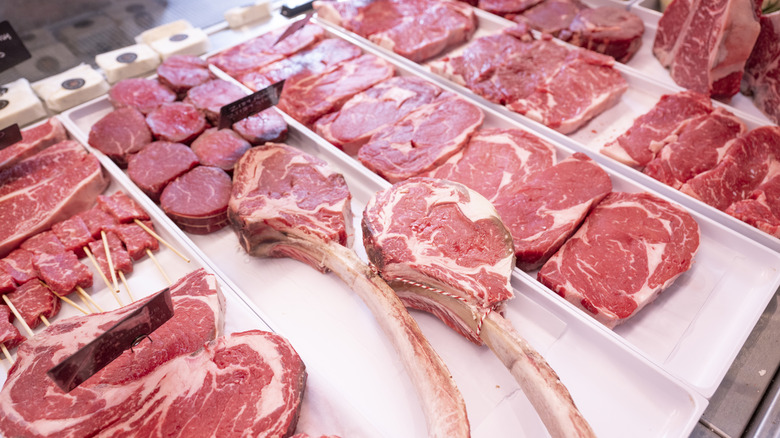 A grocer section of meat trimmed for sale.