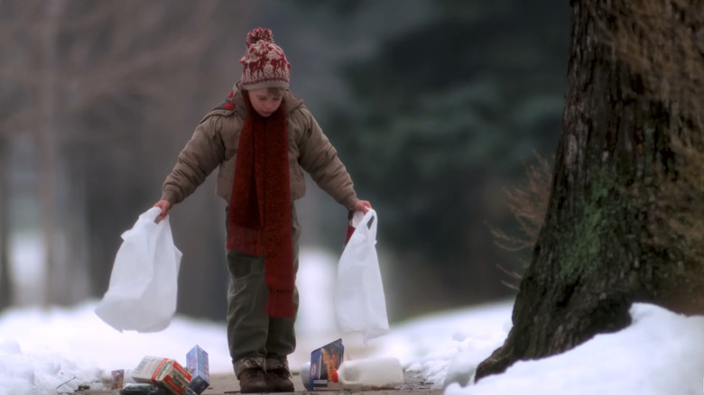 Kevin McCallister with broken grocery bags.