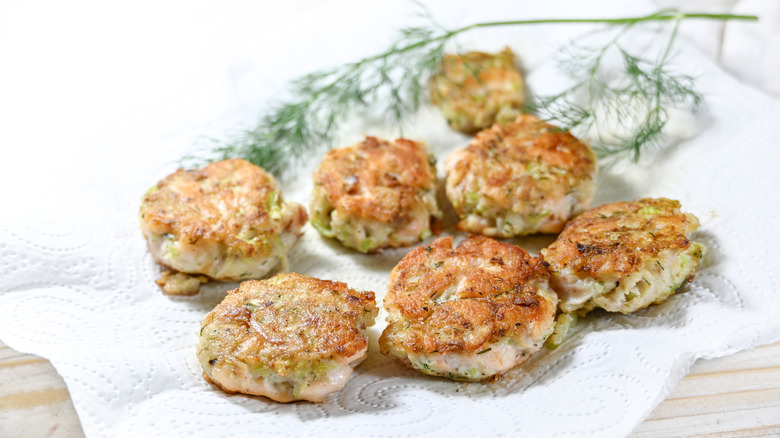 fish cakes draining on a paper towel