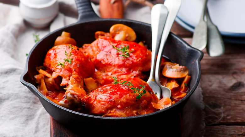 chicken Marengo in a black pot