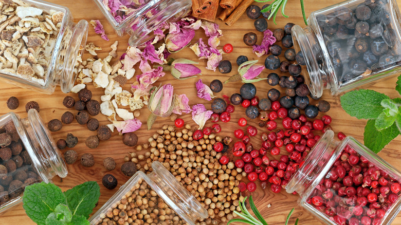 Various herbs and botanicals on wooden table