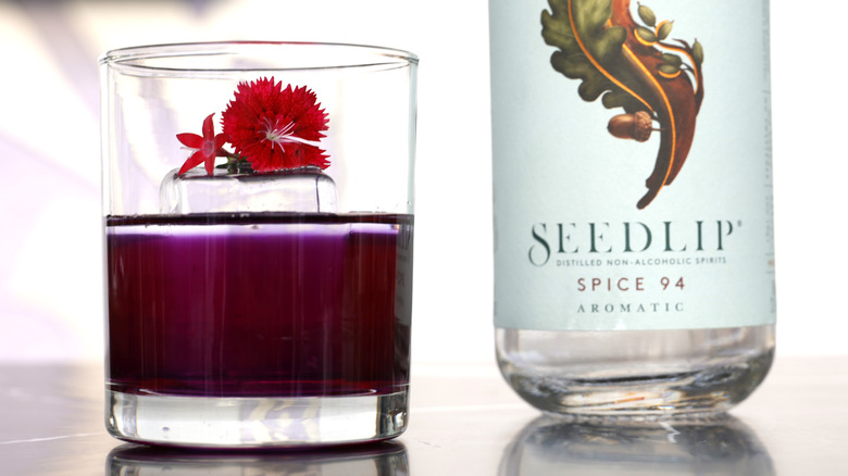 Non-alcoholic cocktail and bottle of Seedlip Spice 94