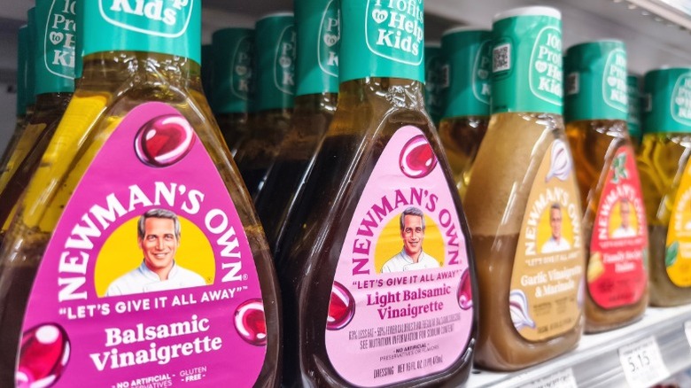 Bottles of Newman's Own balsamic vinaigrette on a supermarket shelf.