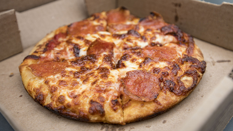 A  pepperoni pizza with bubbling cheese