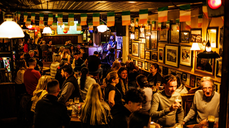 People eat and drink in an Irish pub