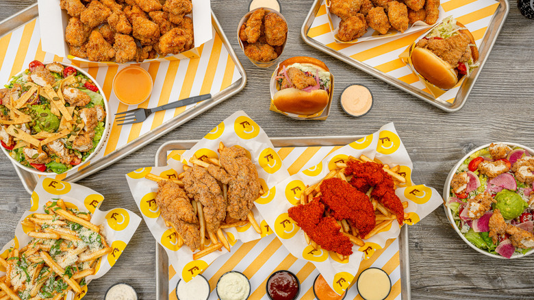 An array of foods from Starbird Chicken, one of the premier vendors for Super Bowl LX