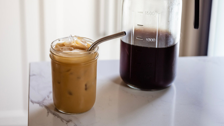 A jar of cold brew coffee on a counter.